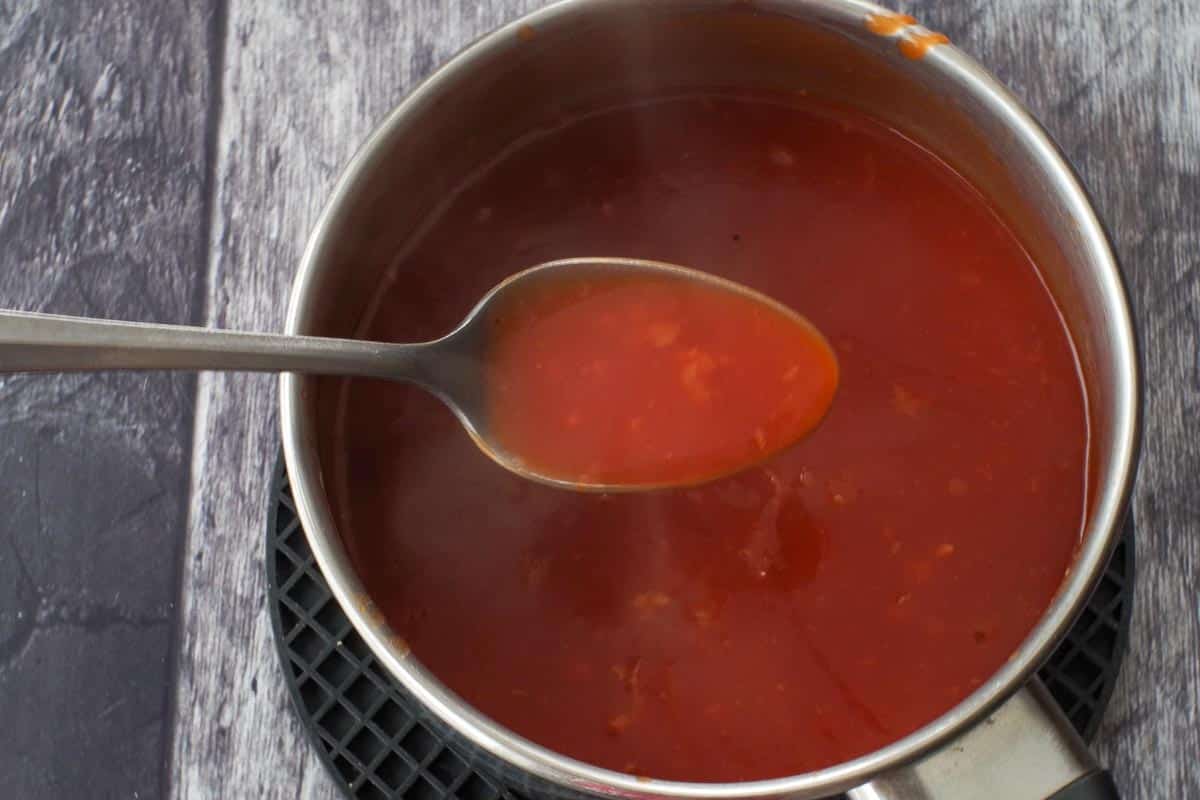 Thickened sauce in a small pot.