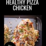 Healthy Sheet Pan Pizza Chicken being lifted off a sheet pan with a black spatula.