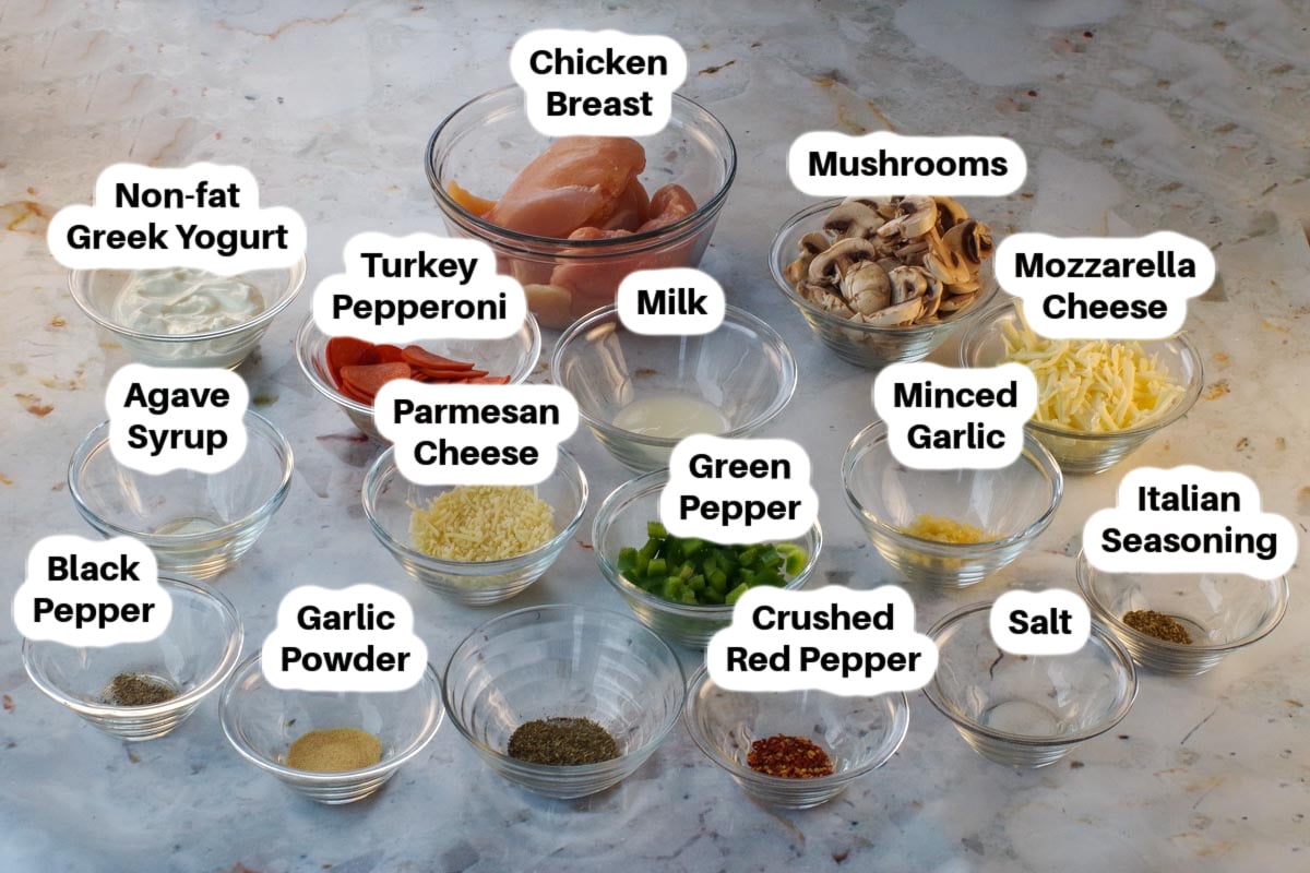 Ingredients in Healthy White Pizza Chicken in glass bowls, labelled.