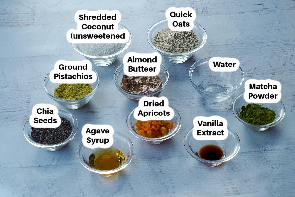 Ingredients in Matcha Pistachio Energy Balls in glass bowls, labelled.