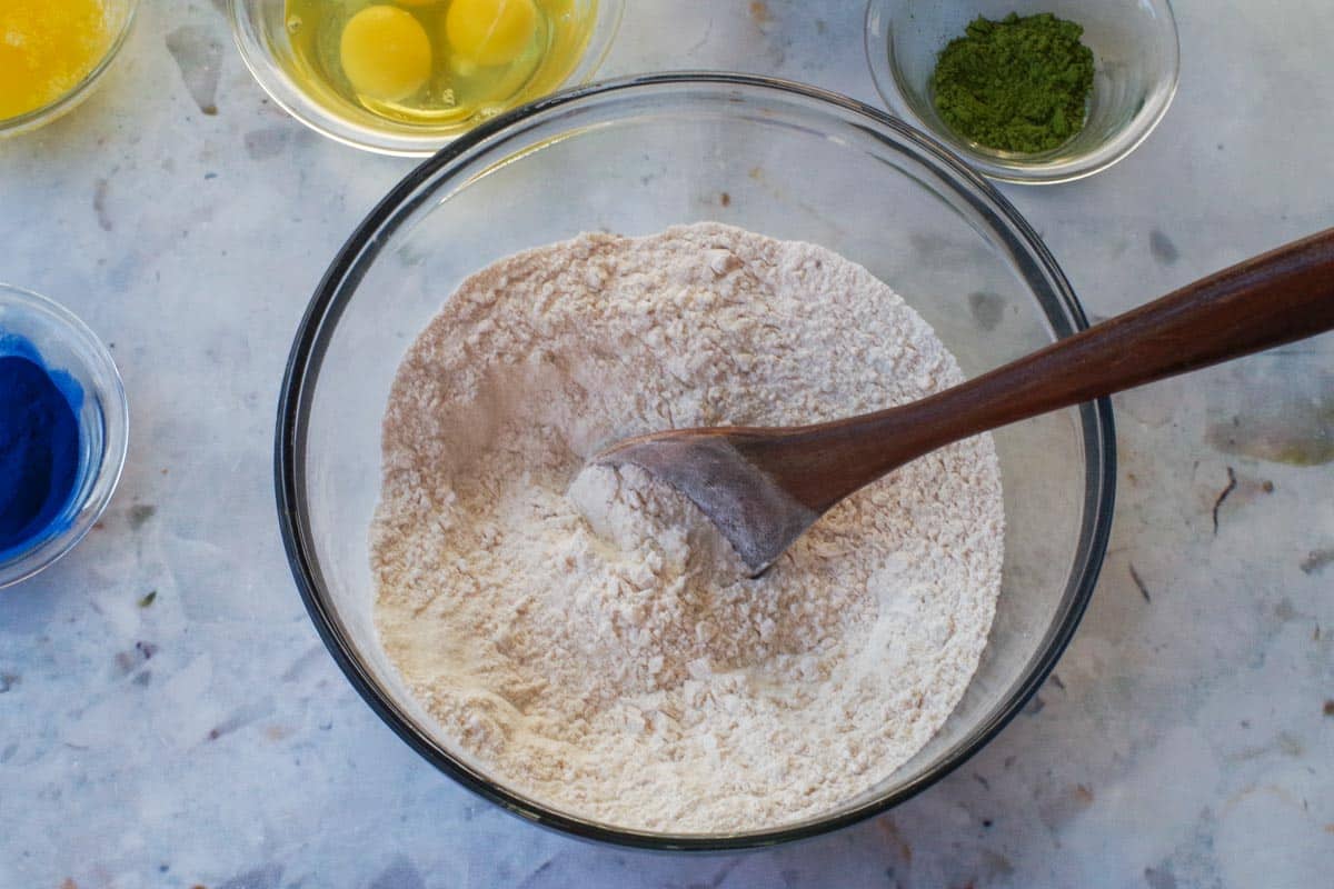 Dry ingredients for Earth Day Pancakes being stirred together in a glass bowl.