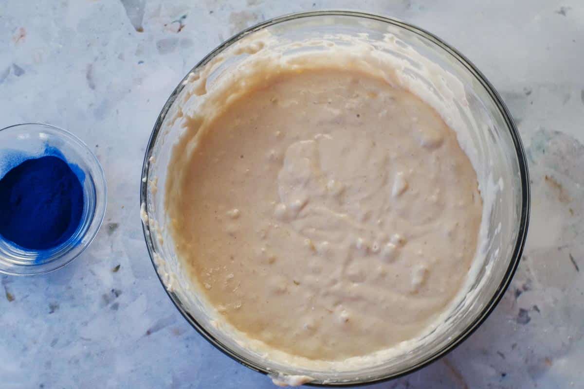 Wet ingredients mixed into dry ingredients for Earth Day Sheet Pan Pancakes.