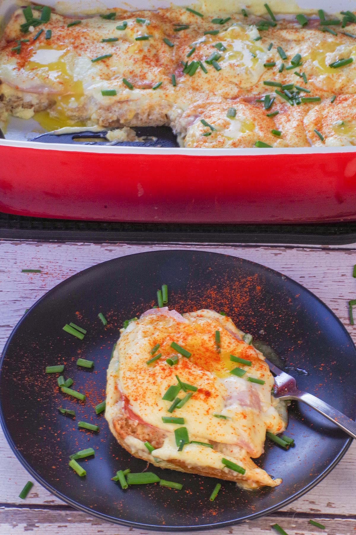 A slice of Eggs Benedict Casserole with runny eggs