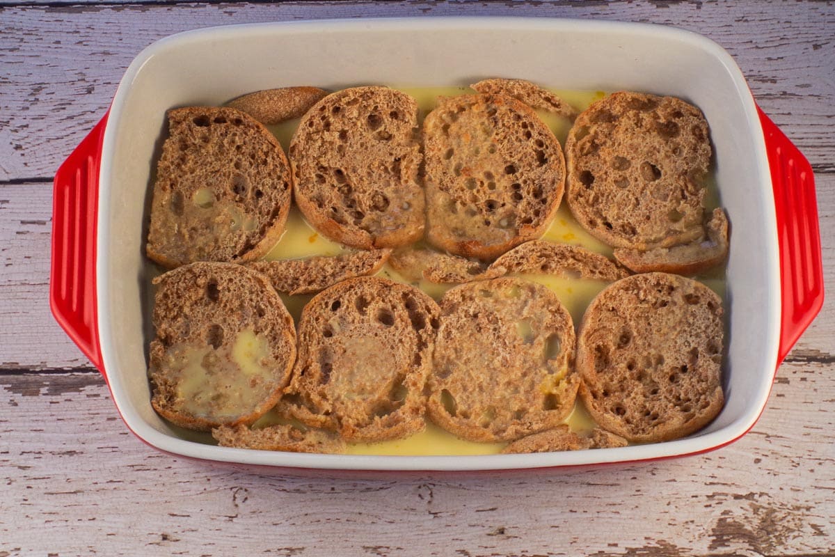 Egg/milk mixture poured between the English muffin halves and pieces.