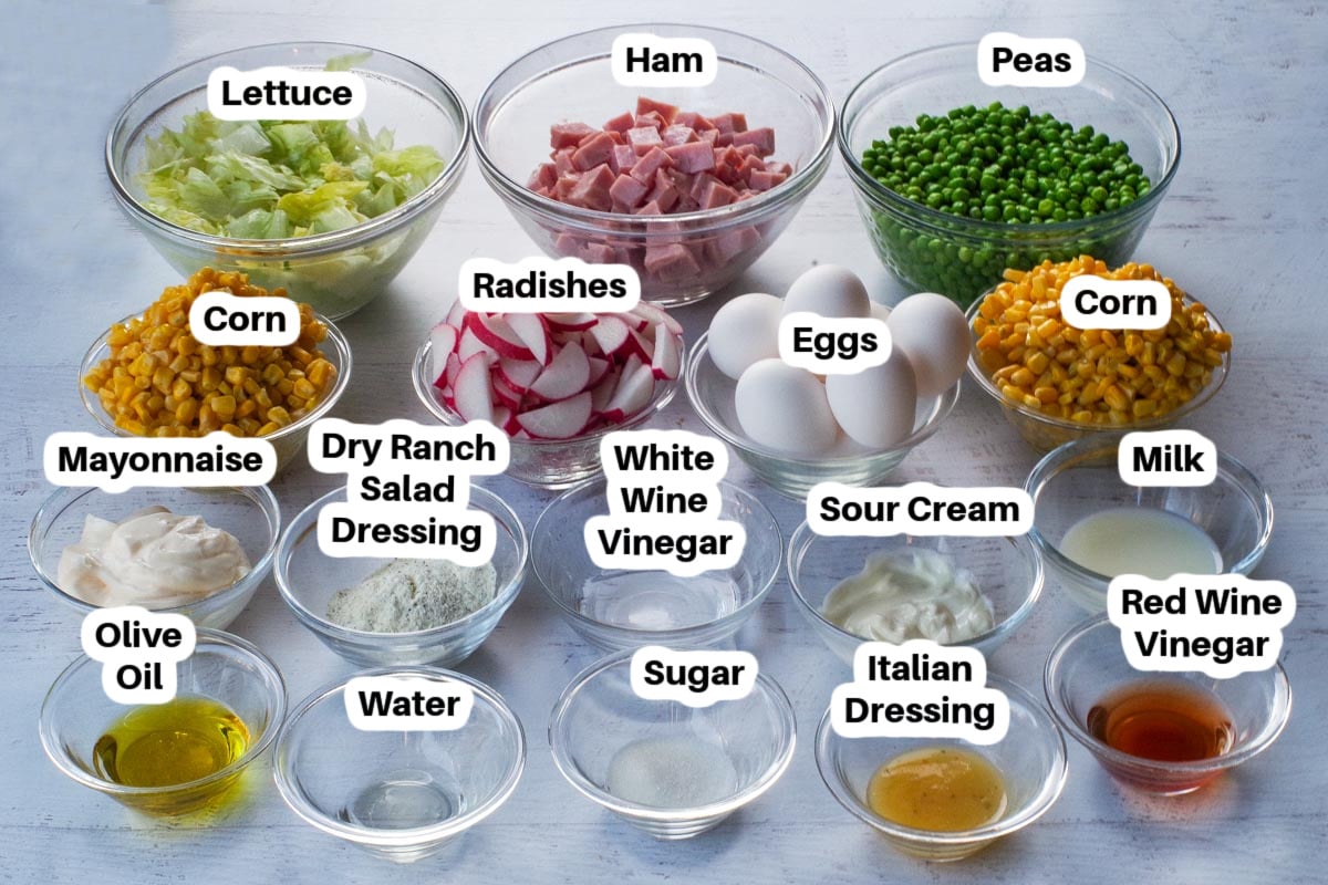 Ingredients in Layered Leftover Ham Salad in glass bowls, labelled.