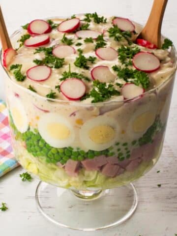 Layered Leftover Ham Salad in a trifle bowl.