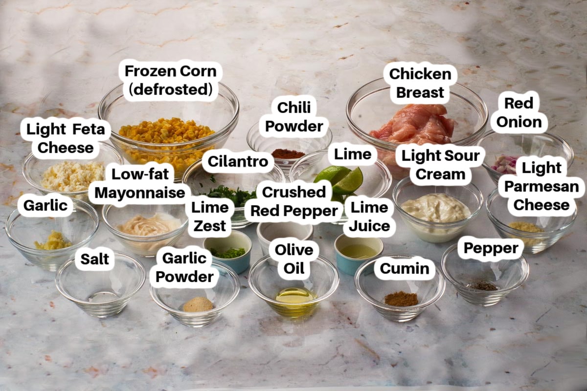 Mexican Street Corn Chicken Skillet recipe ingredients in glass bowls, labelled,