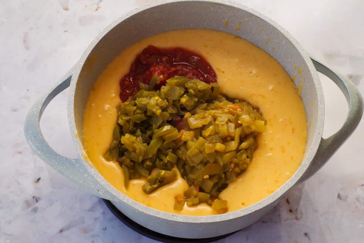 Salsa, green chilis and jalapenos added to cheese mixture.