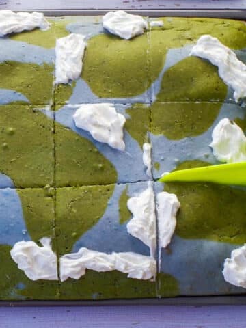 Earth Day Sheet Pan Pancakes with some whipped cream on them,