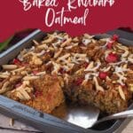 Baked Rhubarb Oatmeal in an 8x8 pan with 2 pieces missing and a pie lifter in the spot where the pieces are missing.