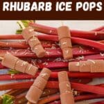 A pile of rhubarb with 6 popsicles (ice pops) laying on top and shredded coconut scattered