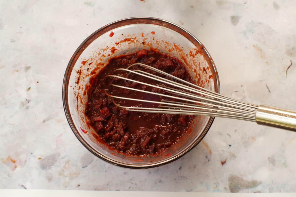 Coccoa whiisked into cooked rhubarb mixture.