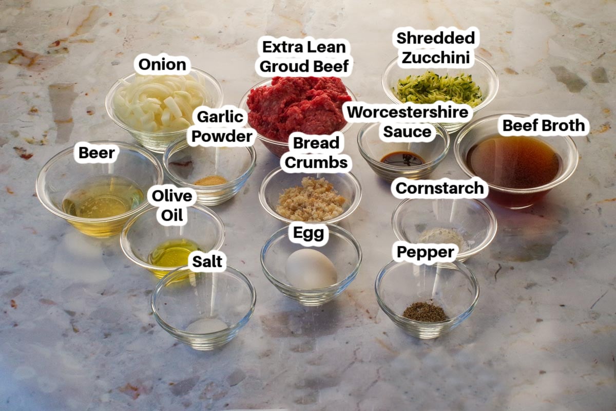 Ingredients in Salisbury Steak with Beer and Onion Gravy recipe, in glass bowls, labelled.