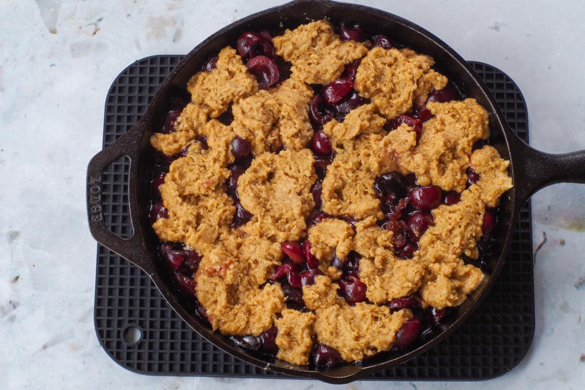 Butterscotch topping dropped onto cherry mixture.