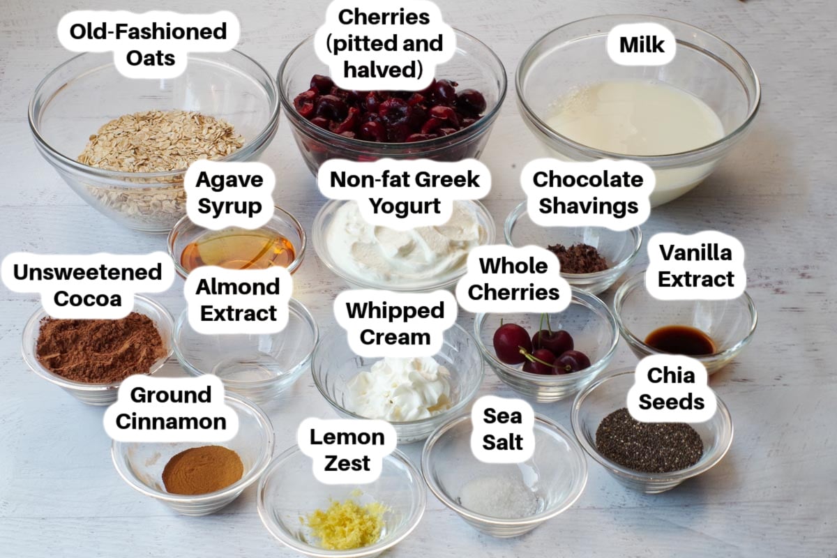 Healthy Black Forest Overnight Oats ingredients in glass bowls, labelled.
