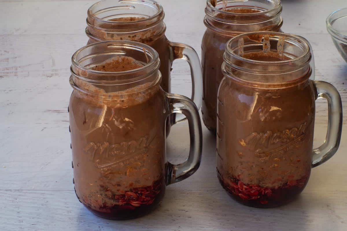 Yogurt, cocoa and milk mixture divided by 4 jars.