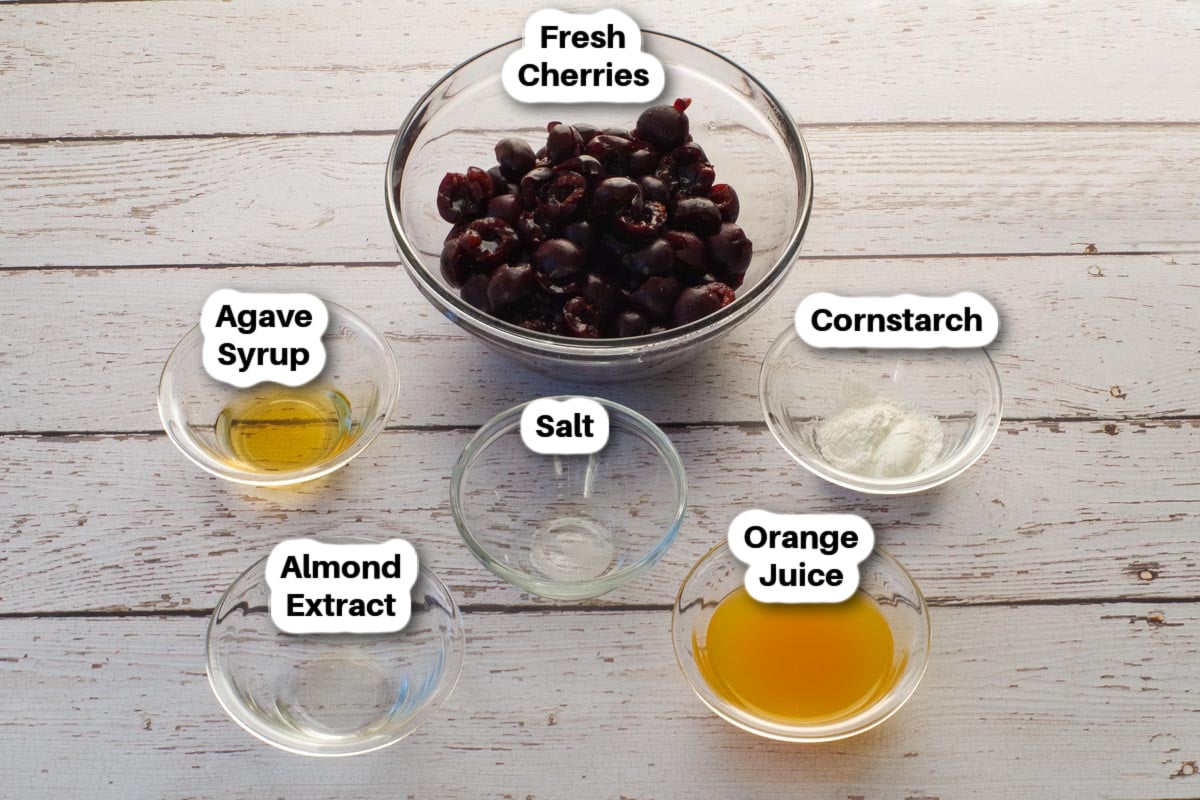 Quick and Healthy Fresh Cherry Sauce Ingredients in glass bowls, labelled.