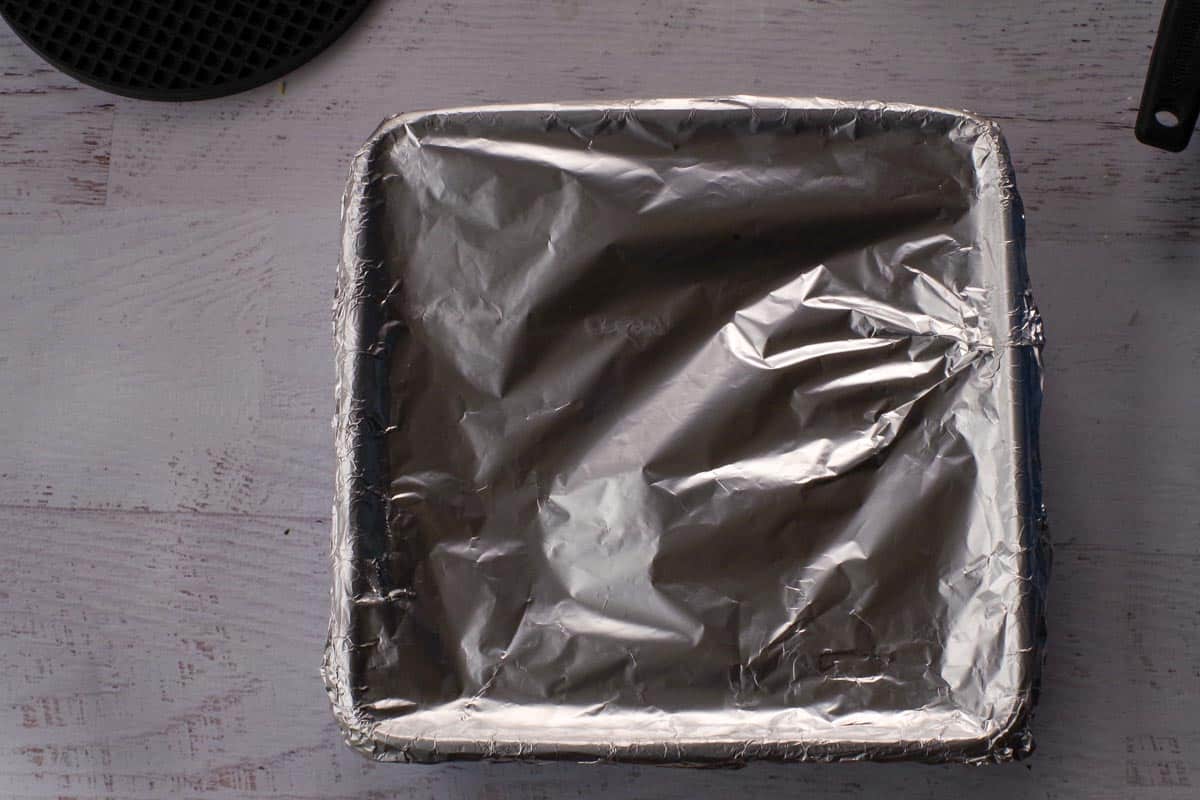 Square pan with Lazy Dolmades covered tightly with aluminum foil