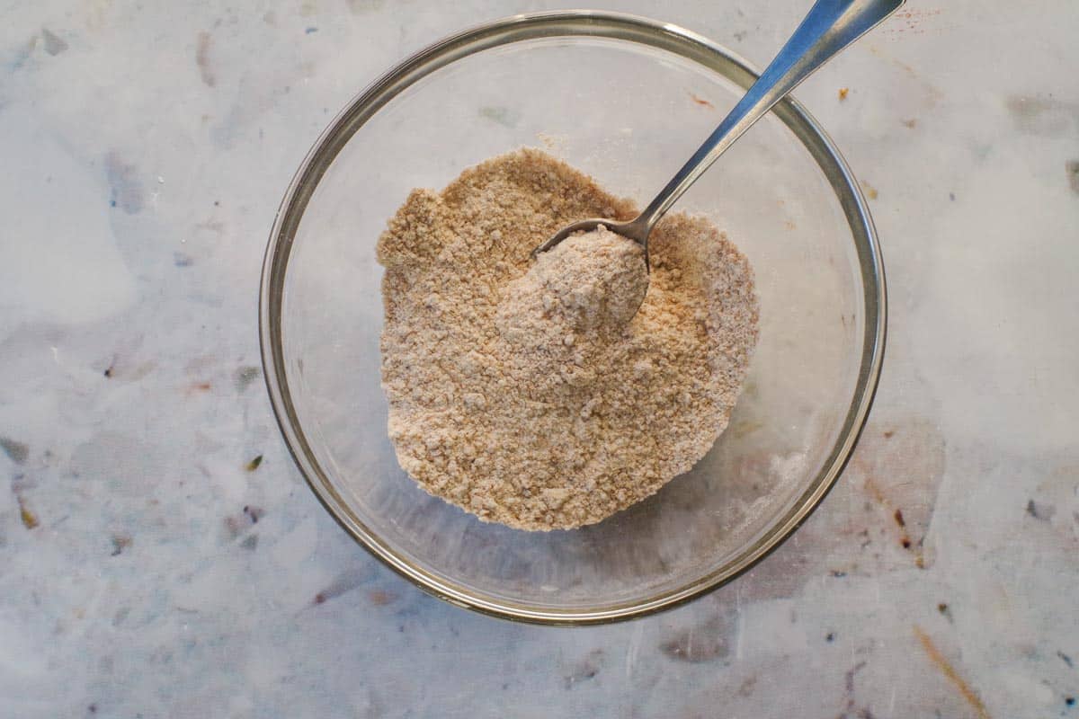 Dry ingrdients mixed together in a medium glass bowl.