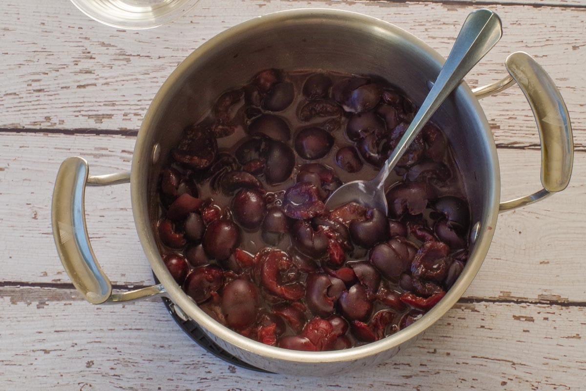 Cherries in a small pot after simmering for 5 minutes.