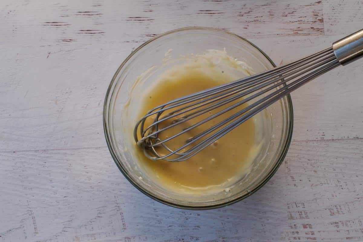 Brown butter and milk whisked into cream cheese/powdered sugar mixture to make the glaze