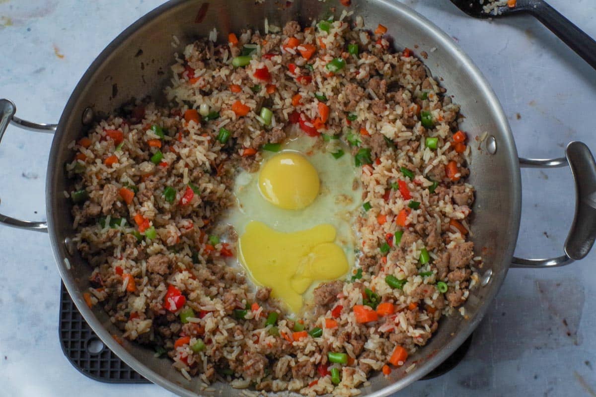 2 eggs added to well in middle of the wok.
