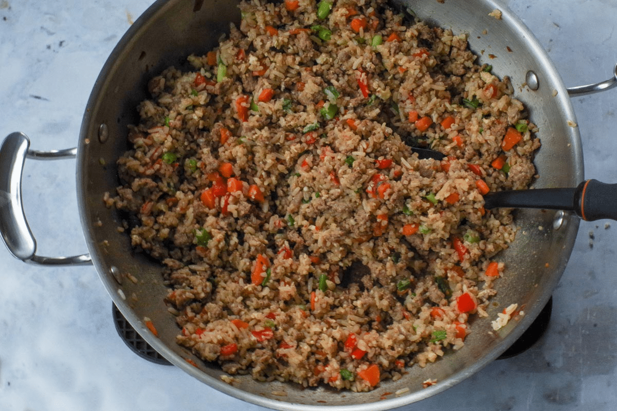 Scrambled eggs mixed into the rice, meat and veggie mixture.