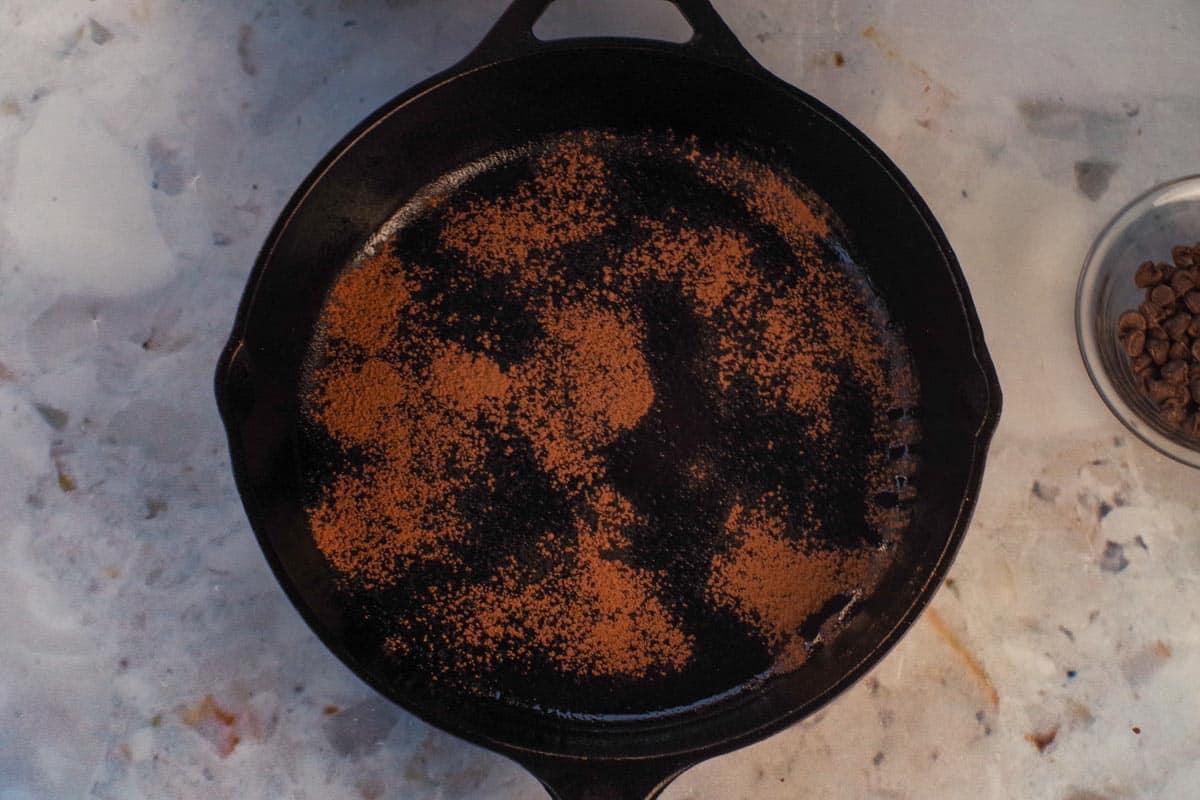 Cocoa sprinkled over prepared pan.