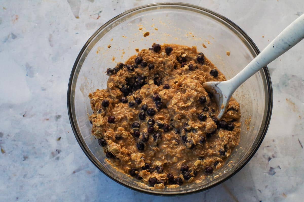 Saskatoon berries folded into batter for the Saskatoon Berry Oatmeal Bars.