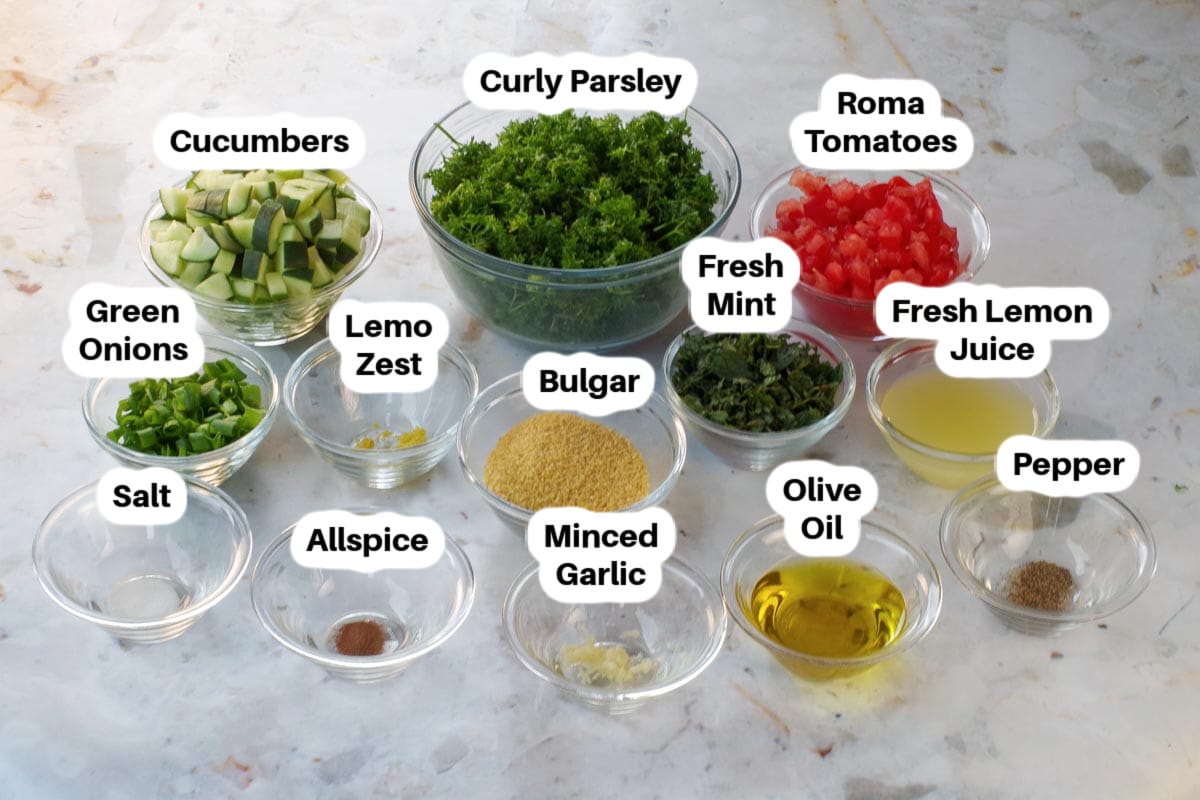 Ingredients in Mediterranean Tabouli in glass bowls, labelled.