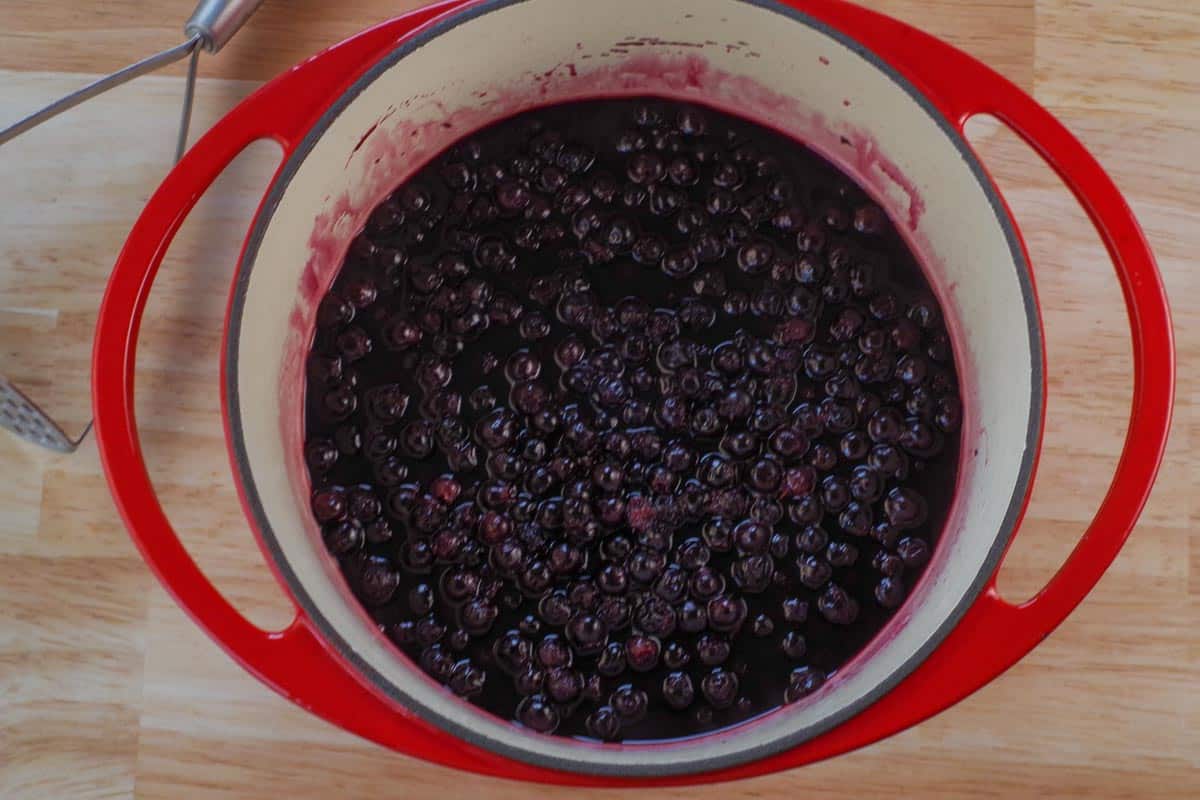 Saskatoon Berries in water after being steamed.