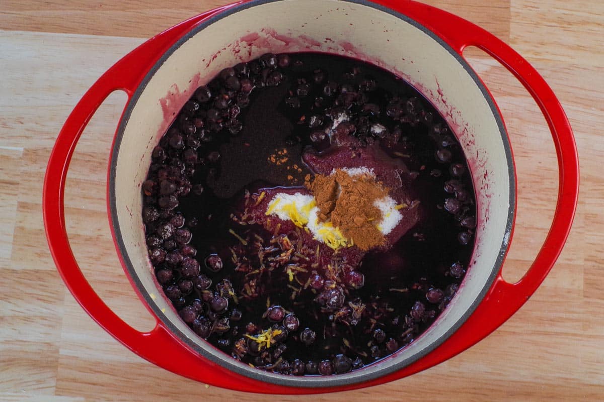 Sugar, cinnamon and lemon zest added to Saskatoon berries, water and lemon juice mixture. 