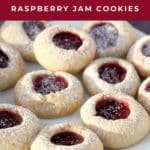 Classic Thumbprint Raspberry Jam Cookies on a white plate.