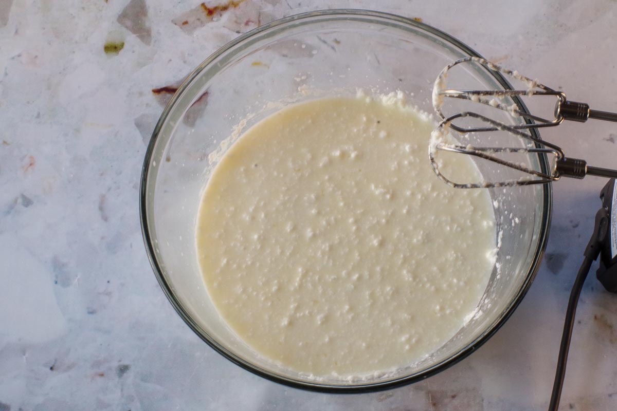 Egg and milk beaten into shortening/sugar mixture in glass bowl with electric mixer.