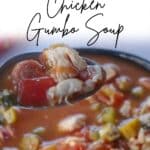 Healthy and Hearty Chicken Gumbo Soup (Campbell's Copycat) being held up on a spoon, over a bowl.